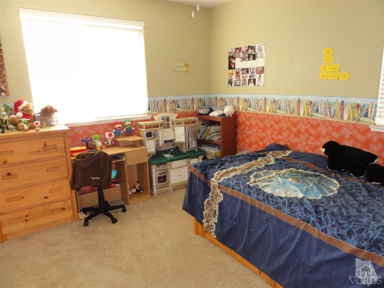 1568 Hidden Ranch Drive Simi Valley, CA 93063 - Photo 14 of 16 a bed sitting in a bedroom next to a window