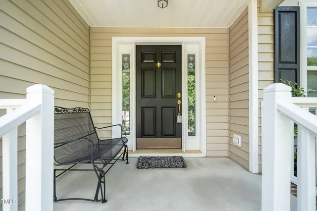 a view of entryway with a door and chair