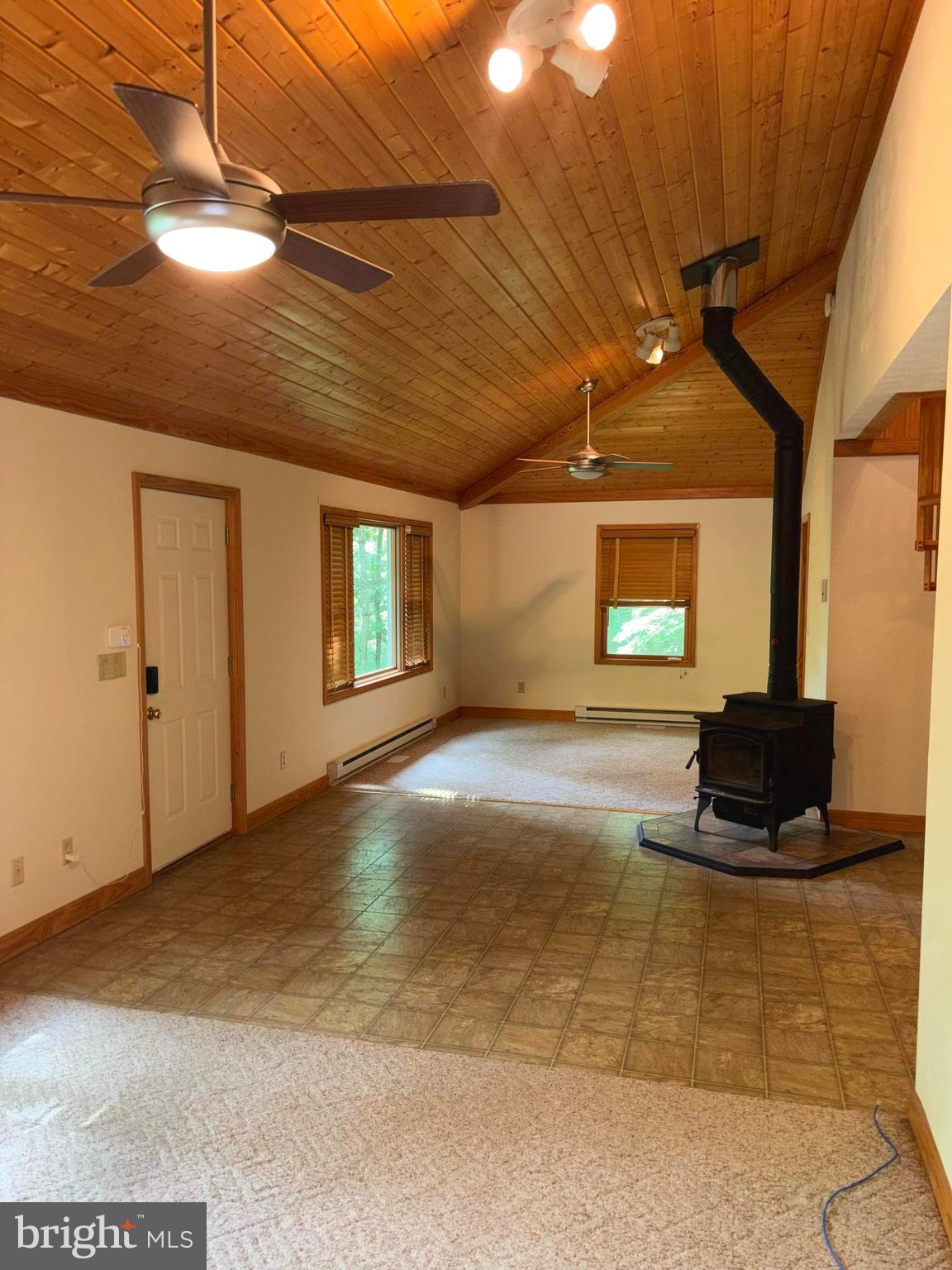251 Riffey Mountain Lane Mathias, WV 26812 - Photo 5 of 33 Great room with wood stove