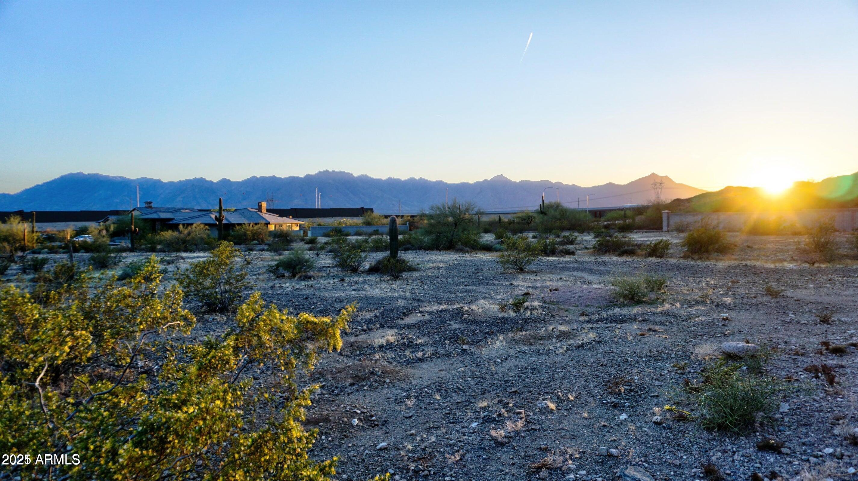 16722 South 32nd Lane, Unit 68 Phoenix, AZ 85045 - Photo 5 of 9 a view of a lake with a mountain in the background