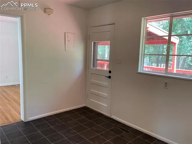 a view of an empty room and window