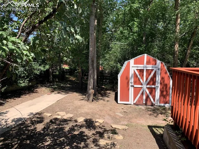 a view of backyard of a house