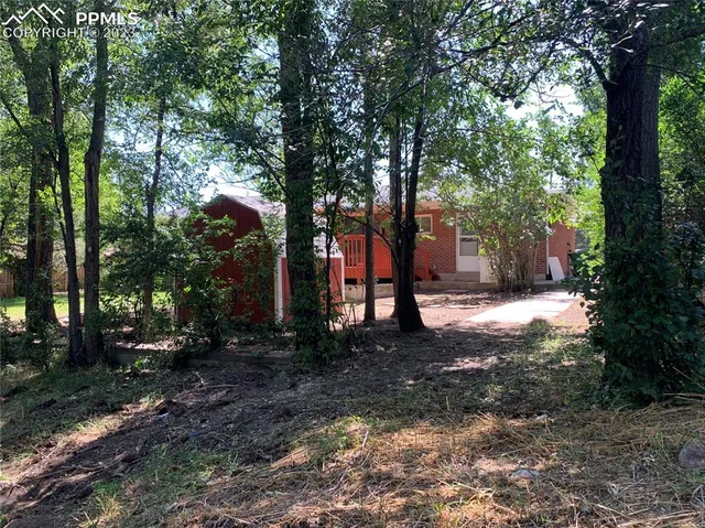 a backyard of a house with lots of green space