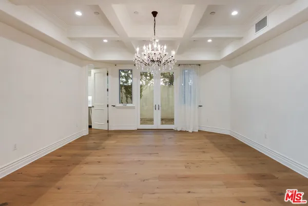 a kitchen with stainless steel appliances kitchen island granite countertop a stove a sink and a microwave