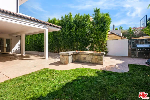 a view of a room with wooden floor and windows