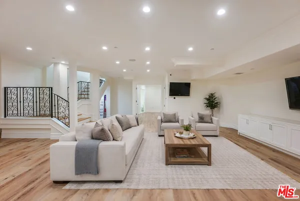 a view of entryway with window and wooden floor