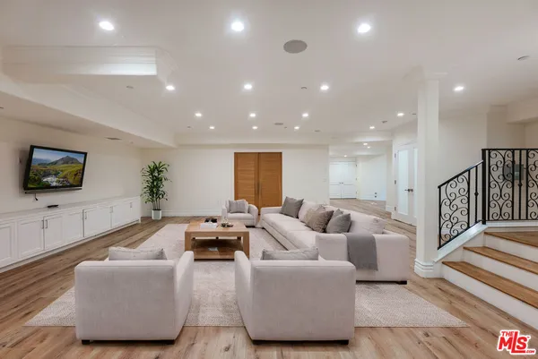 a spacious bedroom with a large bed and a fireplace