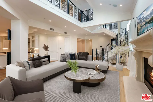 a view of empty room with fireplace and windows