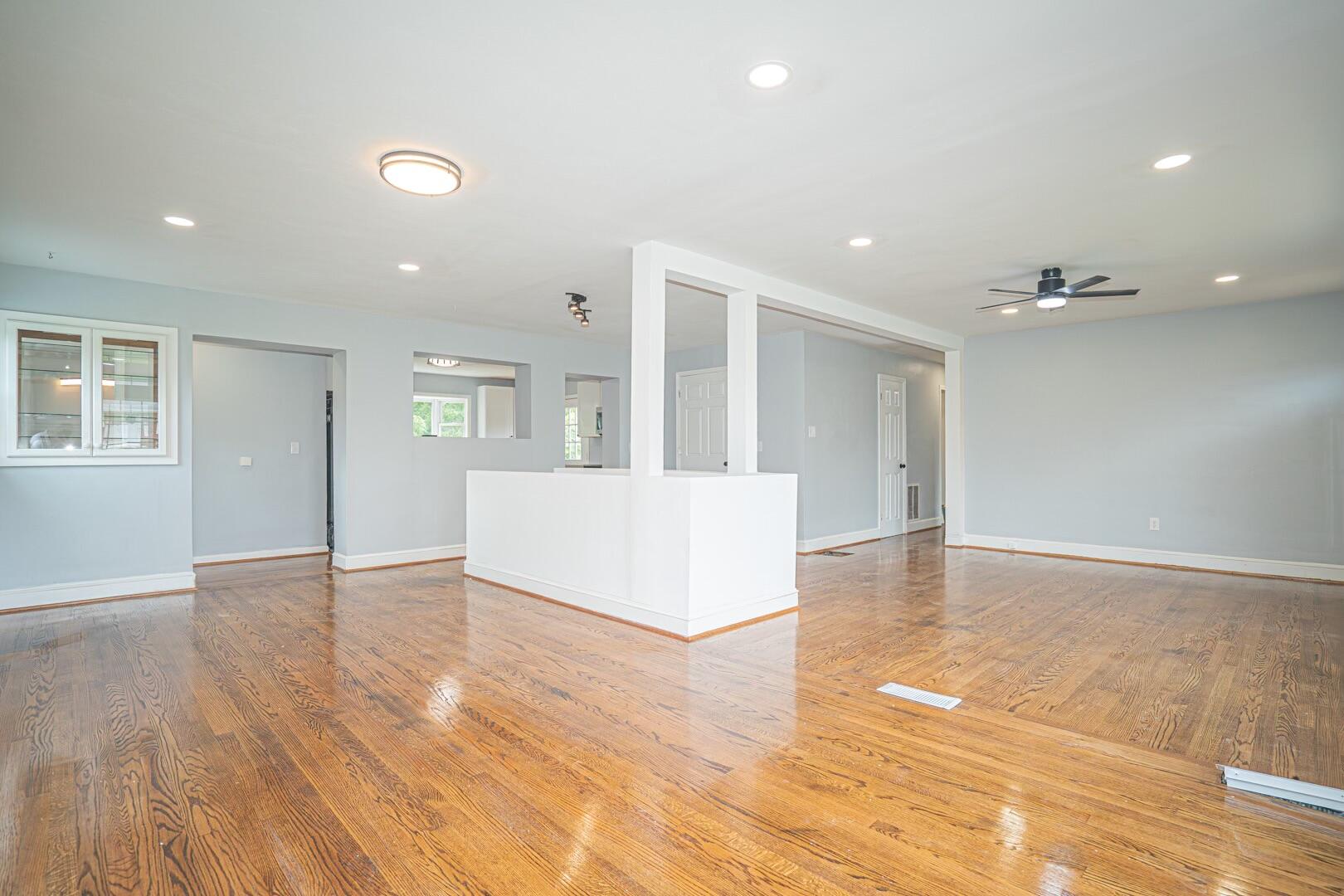47 Westover Road Rocky Mount, VA 24151 - Photo 4 of 19 a view of an empty room with wooden floor and a kitchen