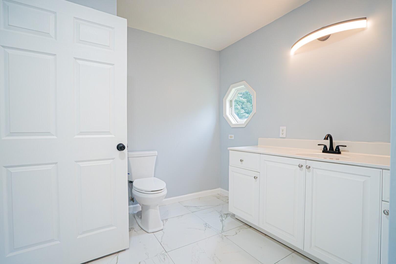 47 Westover Road Rocky Mount, VA 24151 - Photo 10 of 19 a bathroom with a sink a toilet and a mirror