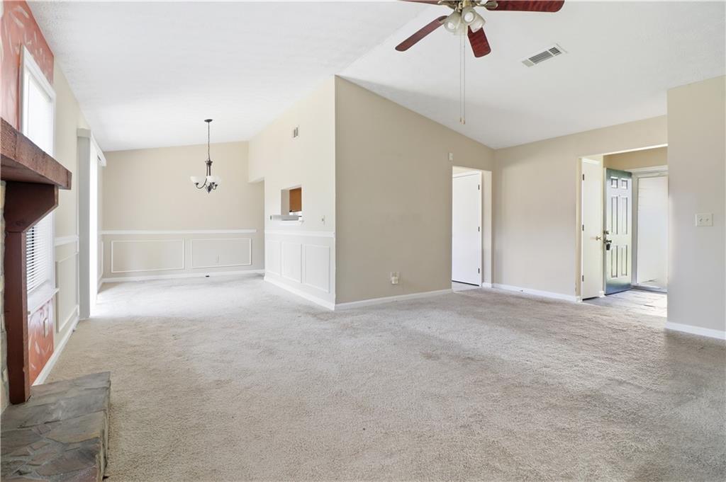 5288 Biffle Downs Road Stone Mountain, GA 30088 - Photo 5 of 18 a view of an empty room with a fireplace