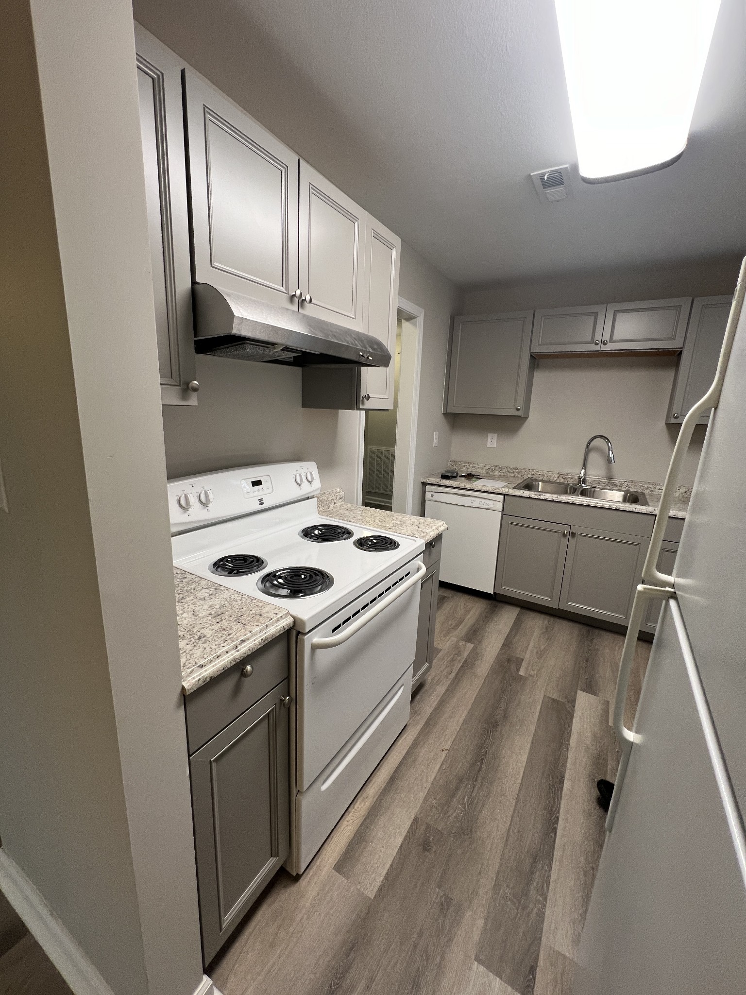 213 Notgrass Road Clarksville, TN 37042 - Photo 4 of 12 a kitchen with a stove sink and refrigerator