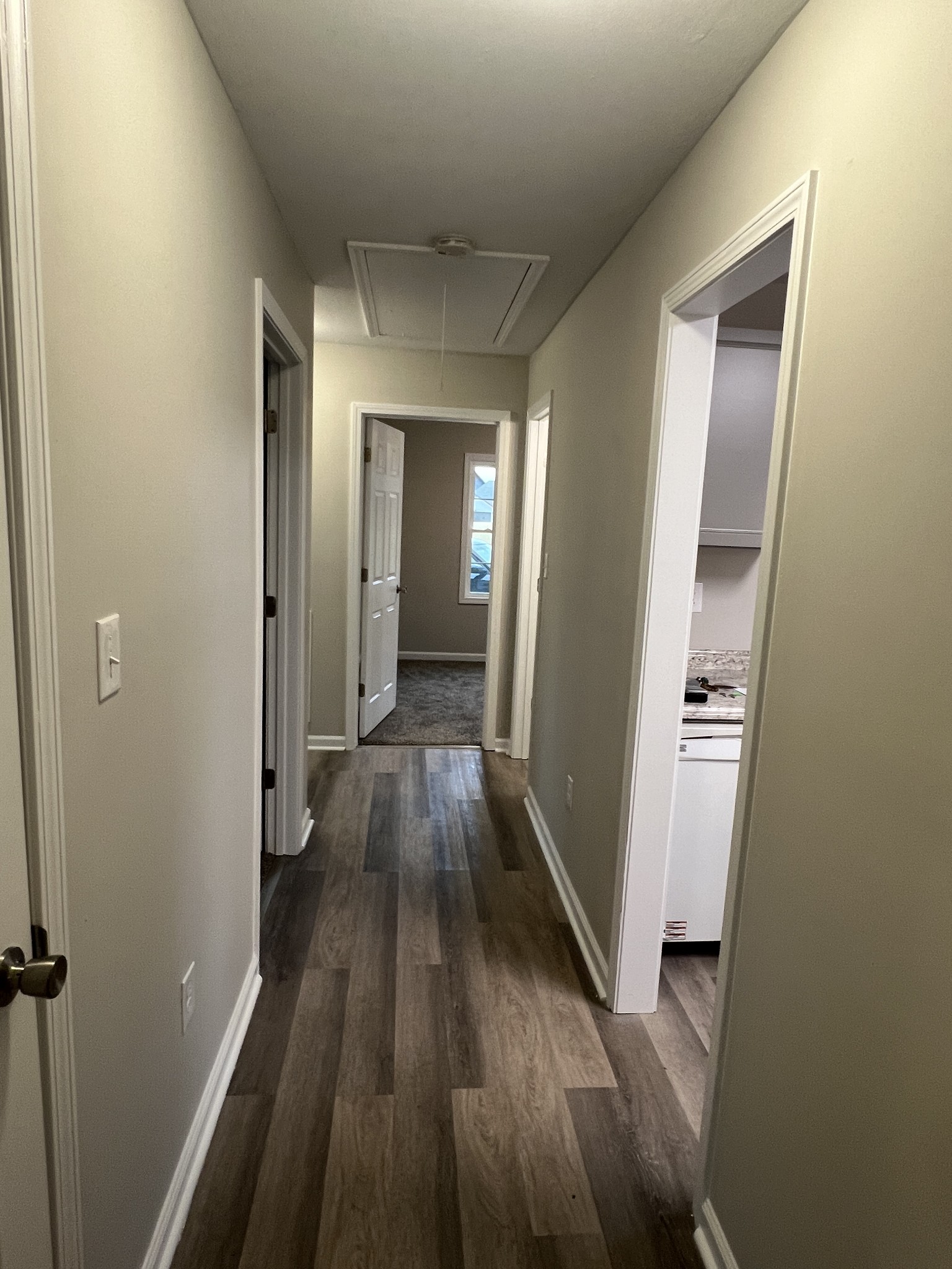 213 Notgrass Road Clarksville, TN 37042 - Photo 7 of 12 a view of a hallway with wooden floor