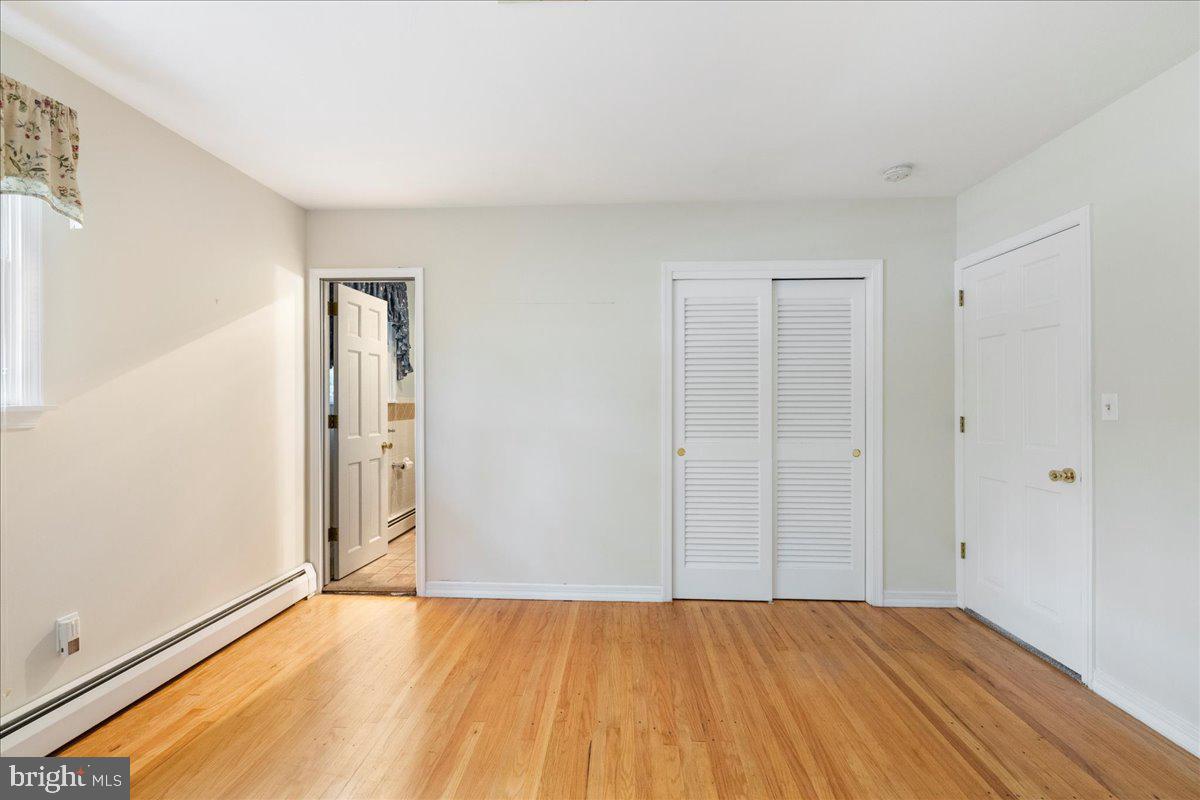 46 Hickory Lane Chalfont, PA 18914 - Photo 21 of 36 a view of an empty room and wooden floor
