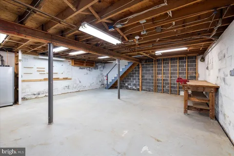 a view of empty room with wooden ceiling