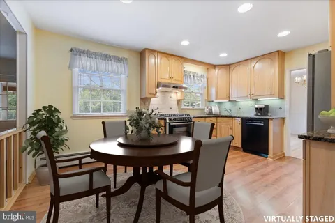 a kitchen with a table and chairs in it