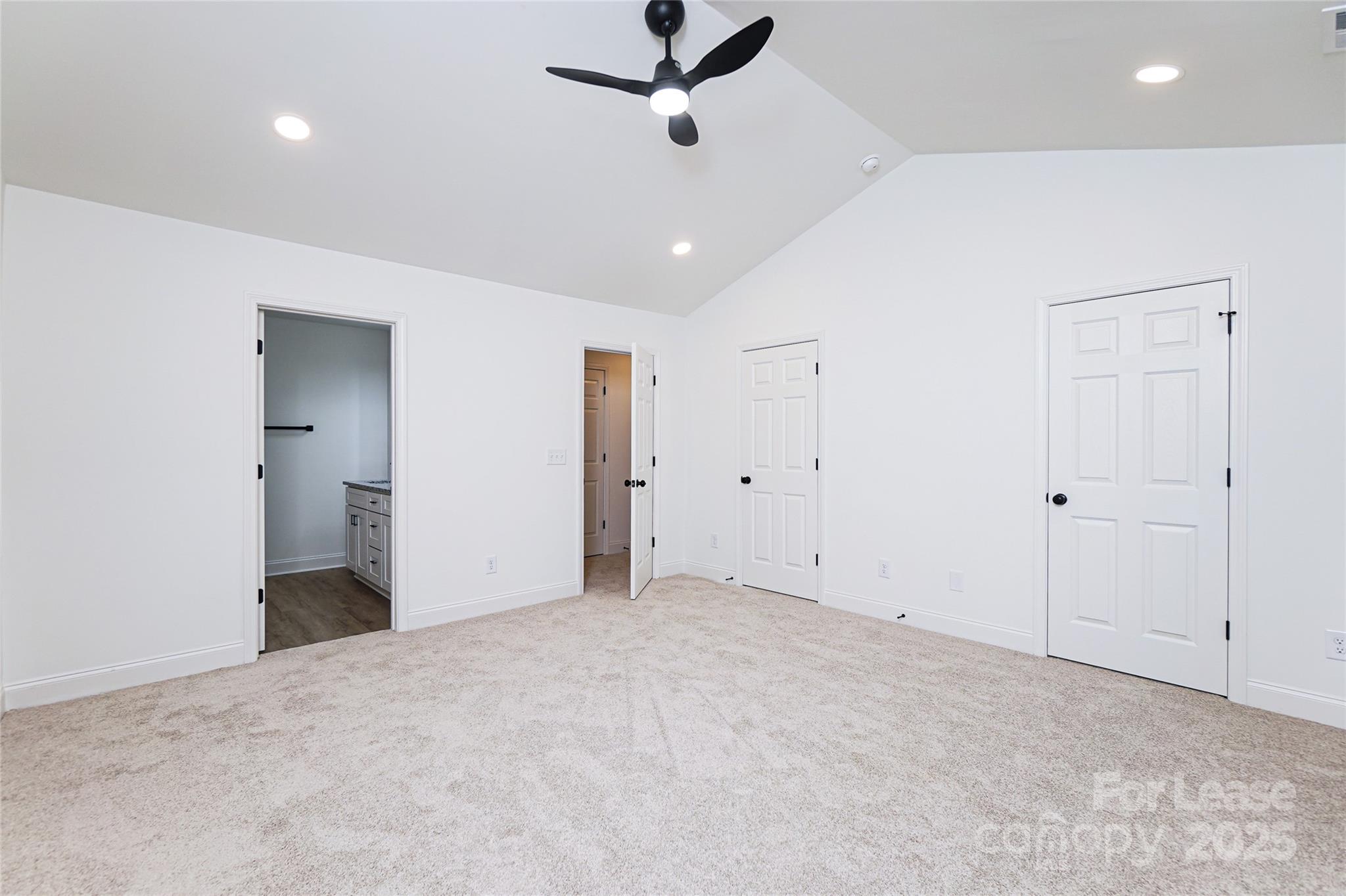 3222 Sam Wilson Road Charlotte, NC 28214 - Photo 15 of 31 a view of a livingroom with a ceiling fan & kitchen space