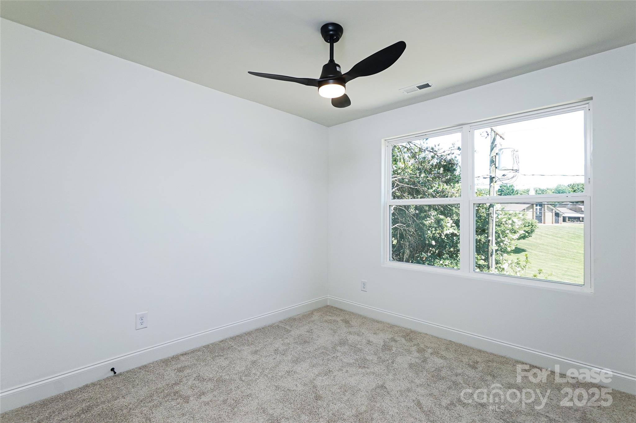 3222 Sam Wilson Road Charlotte, NC 28214 - Photo 23 of 31 an empty room with a window