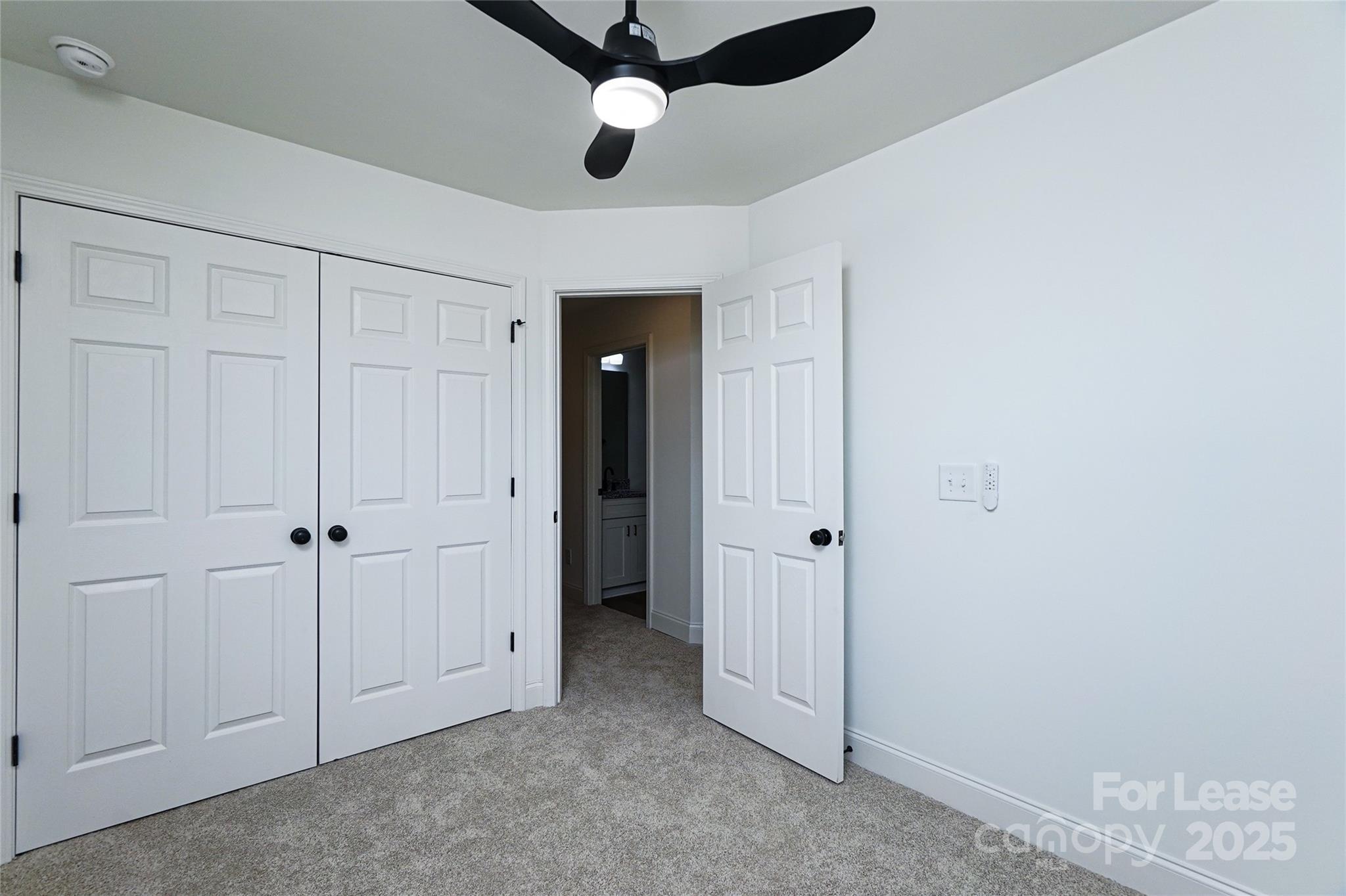 3222 Sam Wilson Road Charlotte, NC 28214 - Photo 25 of 31 an empty room with chandelier fan