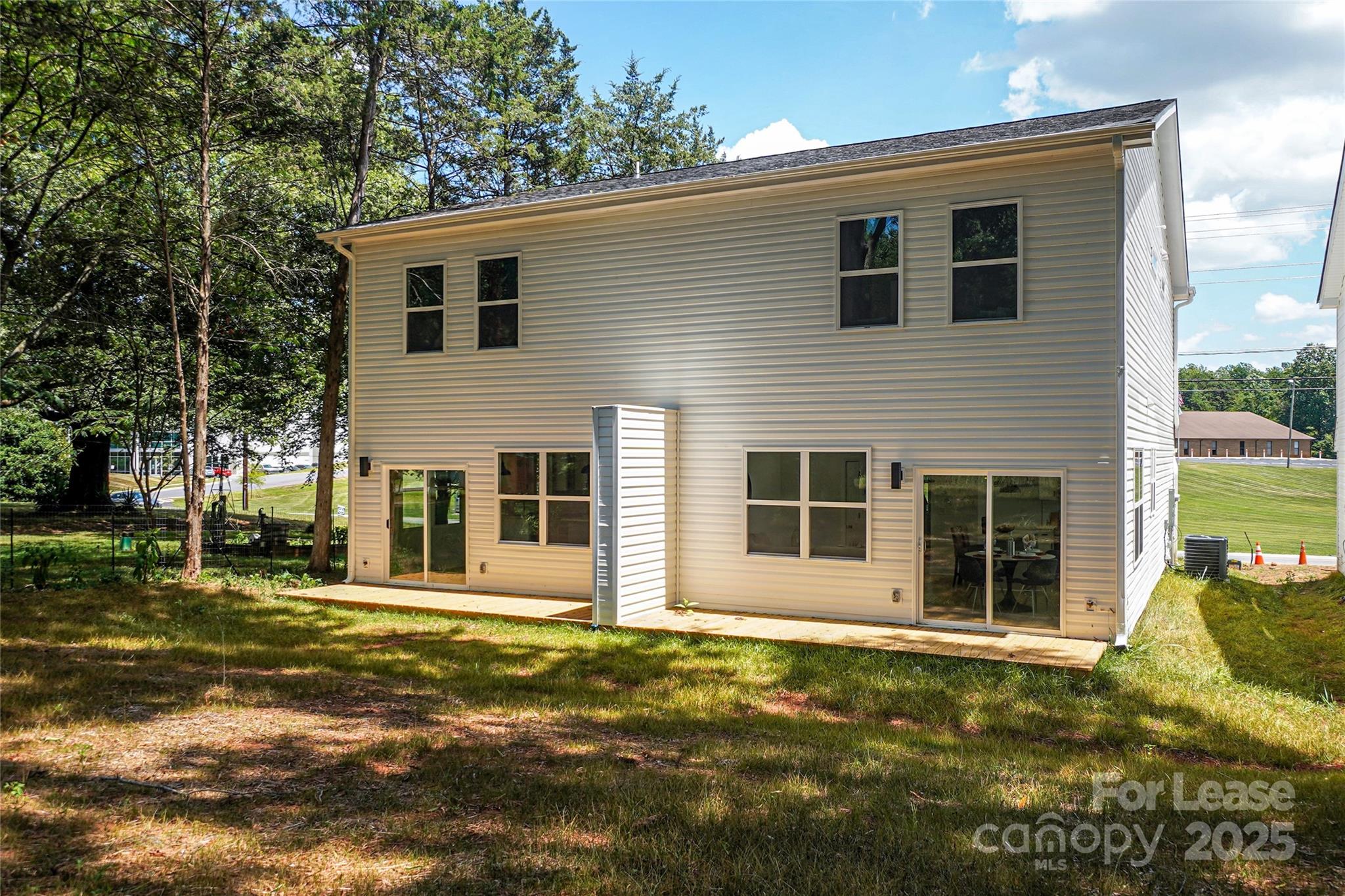 3222 Sam Wilson Road Charlotte, NC 28214 - Photo 30 of 31 a view of a house with a yard