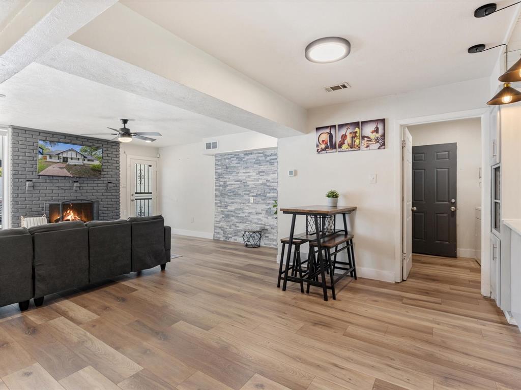 3614 Parader Court Dallas, TX 75228 - Photo 12 of 40 a living room with furniture and a wooden floor