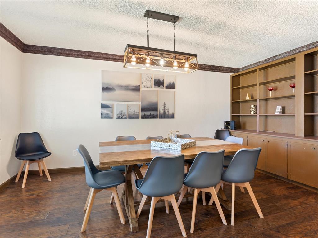 3614 Parader Court Dallas, TX 75228 - Photo 19 of 40 a view of a dining room with furniture and wooden floor