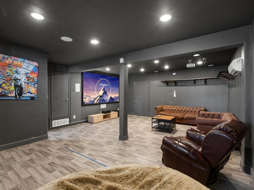 3614 Parader Court Dallas, TX 75228 - Photo 26 of 40 a living room with furniture and a flat screen tv