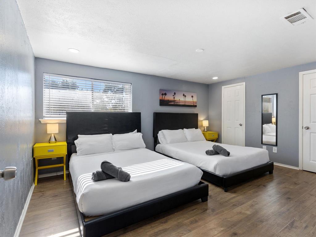 3614 Parader Court Dallas, TX 75228 - Photo 28 of 40 a bedroom with two beds and a couch