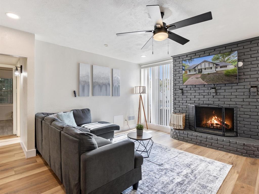 3614 Parader Court Dallas, TX 75228 - Photo 8 of 40 a living room with furniture and a fireplace