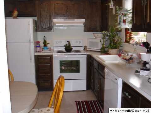 13 Markham Road Brick, NJ 08724 - Photo 3 of 3 a kitchen with a sink appliances and cabinets
