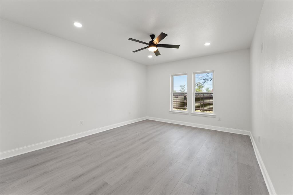 809 South Adelaide Street Terrell, TX 75160 - Photo 5 of 18 wooden floor in an empty room with a window