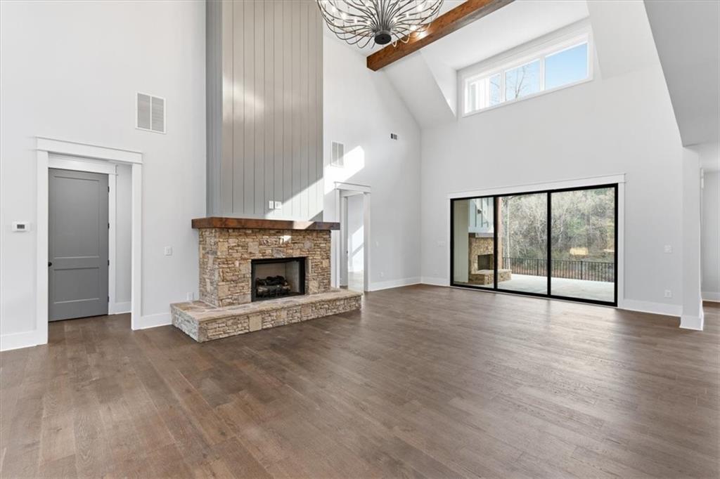 27 Linda Road Southwest Cartersville, GA 30120 - Photo 14 of 51 a view of an empty room with wooden floor fireplace and a window