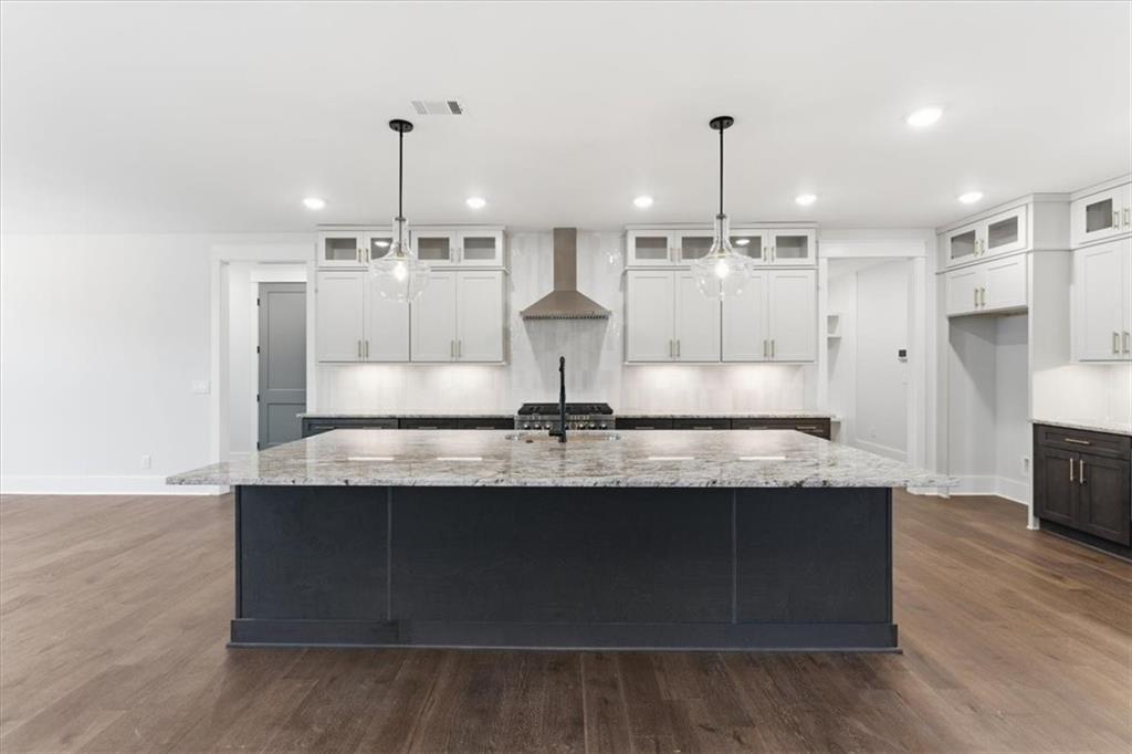 27 Linda Road Southwest Cartersville, GA 30120 - Photo 16 of 51 a large kitchen with granite countertop a sink stainless steel appliances and cabinets