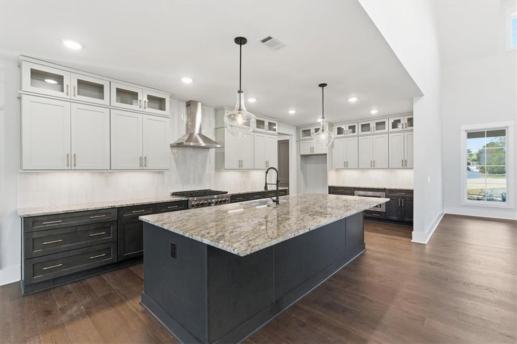 27 Linda Road Southwest Cartersville, GA 30120 - Photo 17 of 51 a kitchen with a stove kitchen island and couches