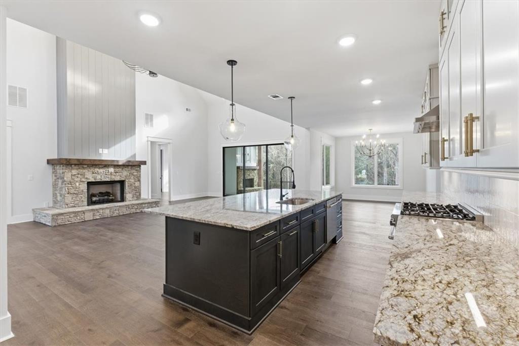 27 Linda Road Southwest Cartersville, GA 30120 - Photo 20 of 51 a kitchen with stainless steel appliances granite countertop a stove and a wooden floors