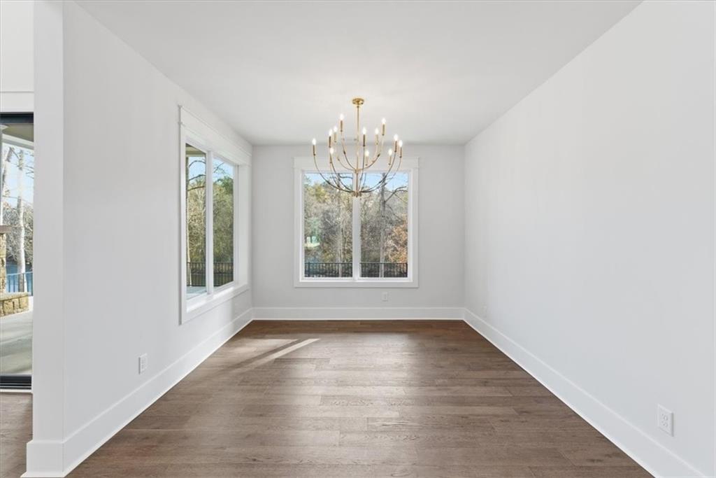 27 Linda Road Southwest Cartersville, GA 30120 - Photo 21 of 51 a view of an empty room with wooden floor and a window
