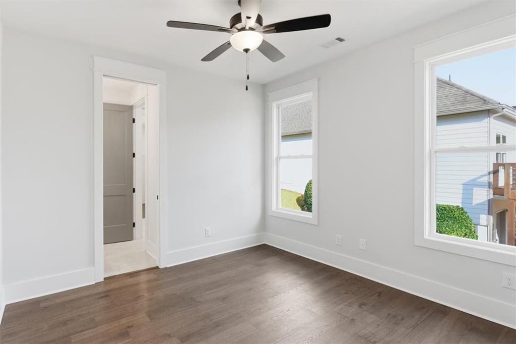 27 Linda Road Southwest Cartersville, GA 30120 - Photo 28 of 51 wooden floor in an empty room with a window