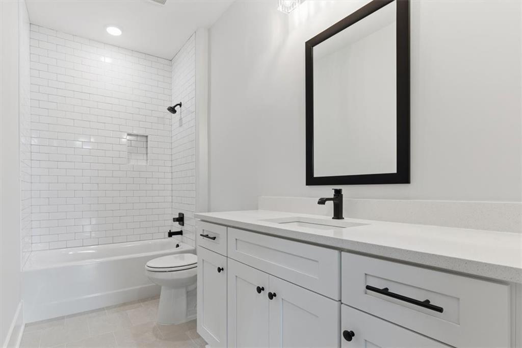 27 Linda Road Southwest Cartersville, GA 30120 - Photo 32 of 51 a bathroom with a toilet a sink a mirror and bathtub