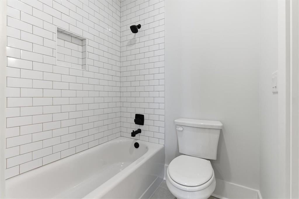 27 Linda Road Southwest Cartersville, GA 30120 - Photo 33 of 51 a white toilet sitting next to a bath tub and a shower