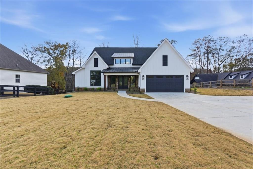 27 Linda Road Southwest Cartersville, GA 30120 - Photo 5 of 51 a view of a house with a yard and a large tree
