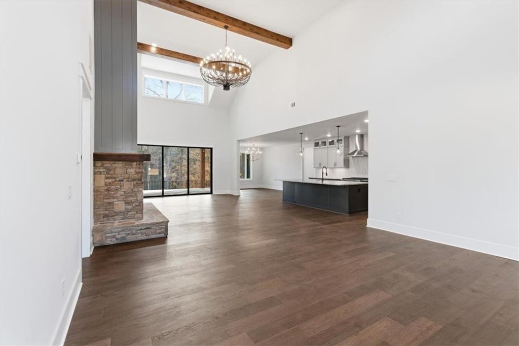 27 Linda Road Southwest Cartersville, GA 30120 - Photo 10 of 51 a view of an empty room with wooden floor and a window
