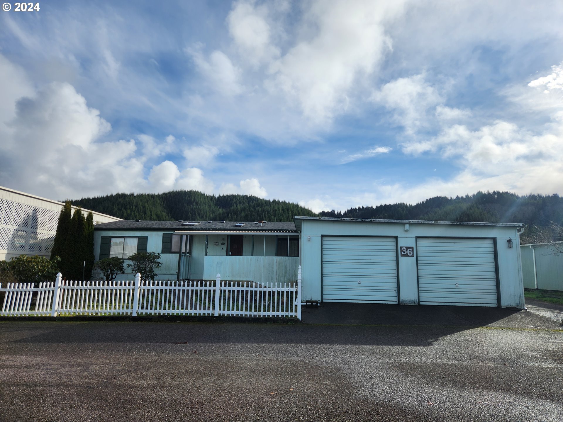 100 River Bend Road, Unit 36 Reedsport, OR 97467 - Photo 1 of 38 a view of a house with iron fence