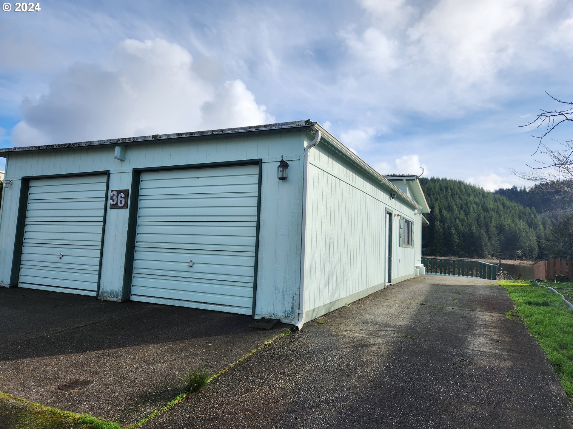 100 River Bend Road, Unit 36 Reedsport, OR 97467 - Photo 2 of 38 a backyard of a house with lots of green space