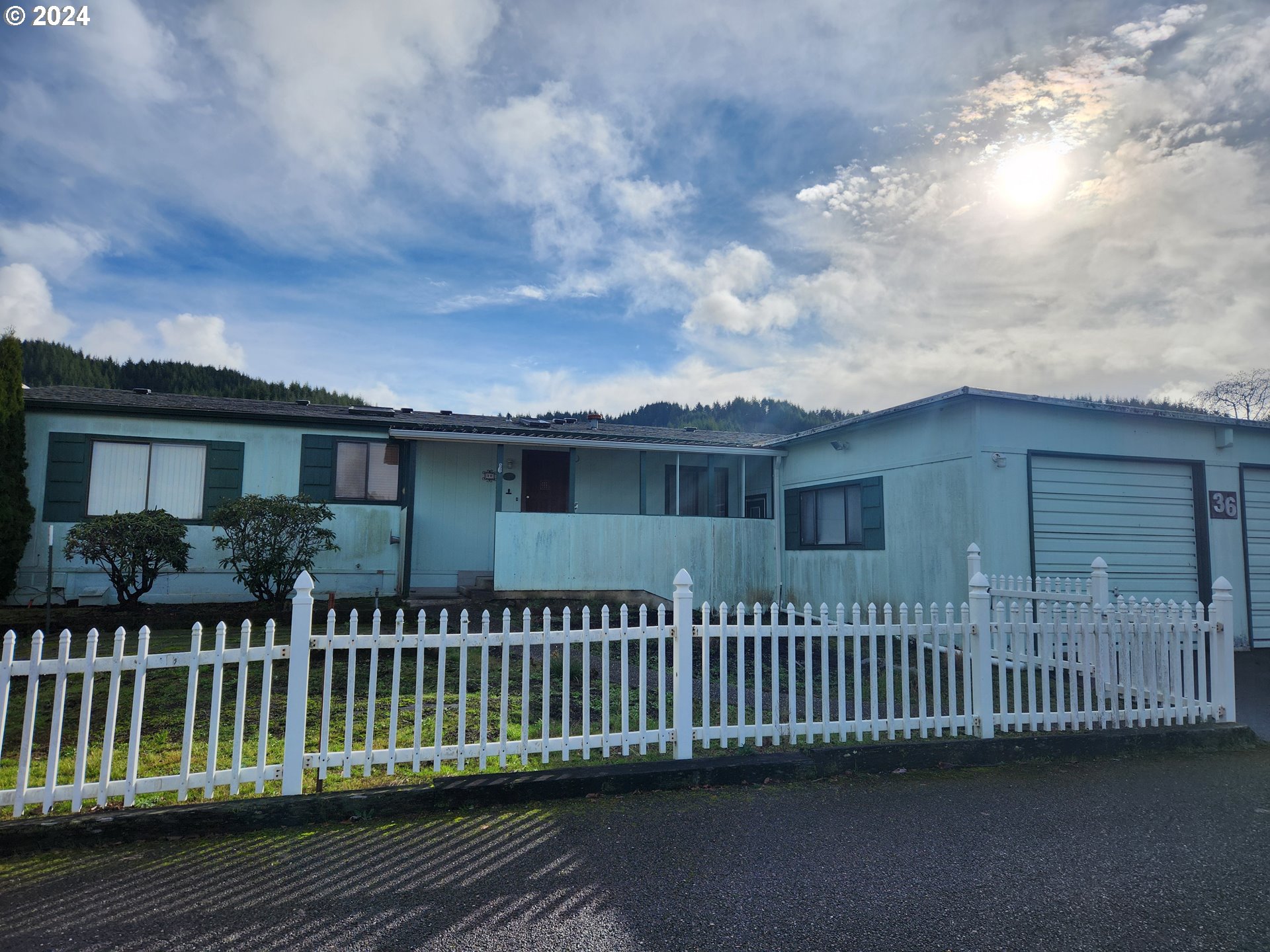100 River Bend Road, Unit 36 Reedsport, OR 97467 - Photo 3 of 38 a view of a house with a deck