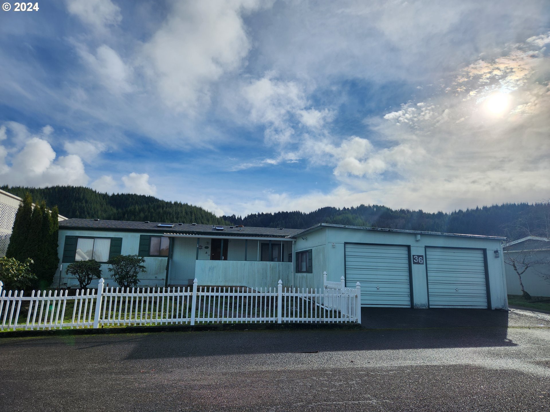 100 River Bend Road, Unit 36 Reedsport, OR 97467 - Photo 4 of 38 a view of a house with a yard