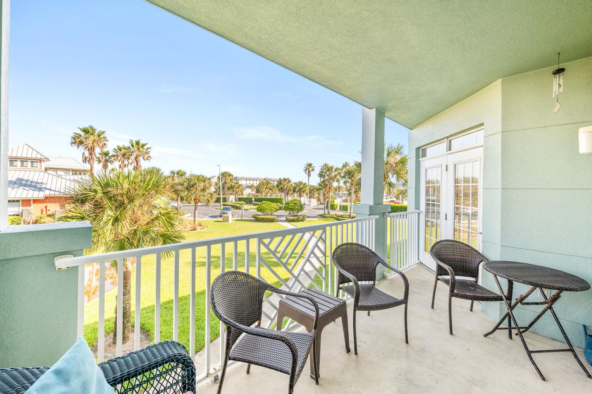 285 Atlantis Circle, Unit 203 St. Augustine, FL 32080 - Photo 12 of 71 a view of a chairs and table in patio