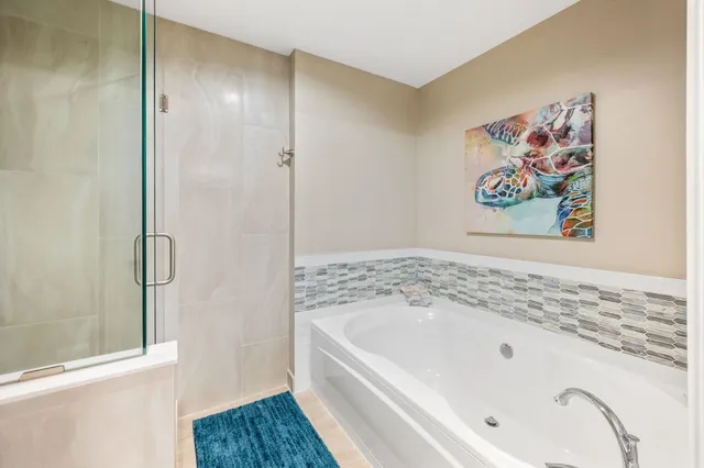 a bedroom with a bed and walk in closet