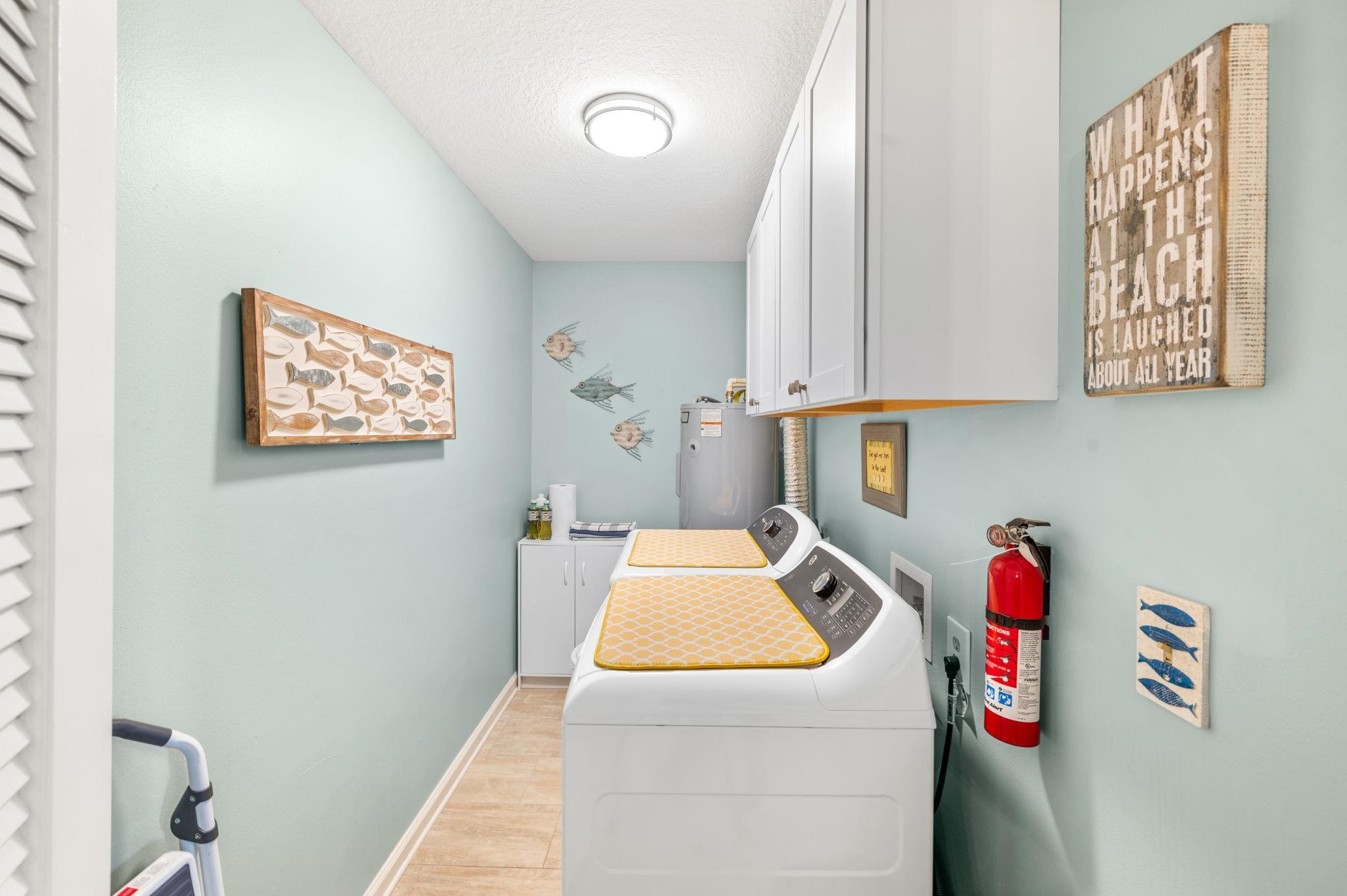 285 Atlantis Circle, Unit 203 St. Augustine, FL 32080 - Photo 37 of 71 a utility room with dryer and washer