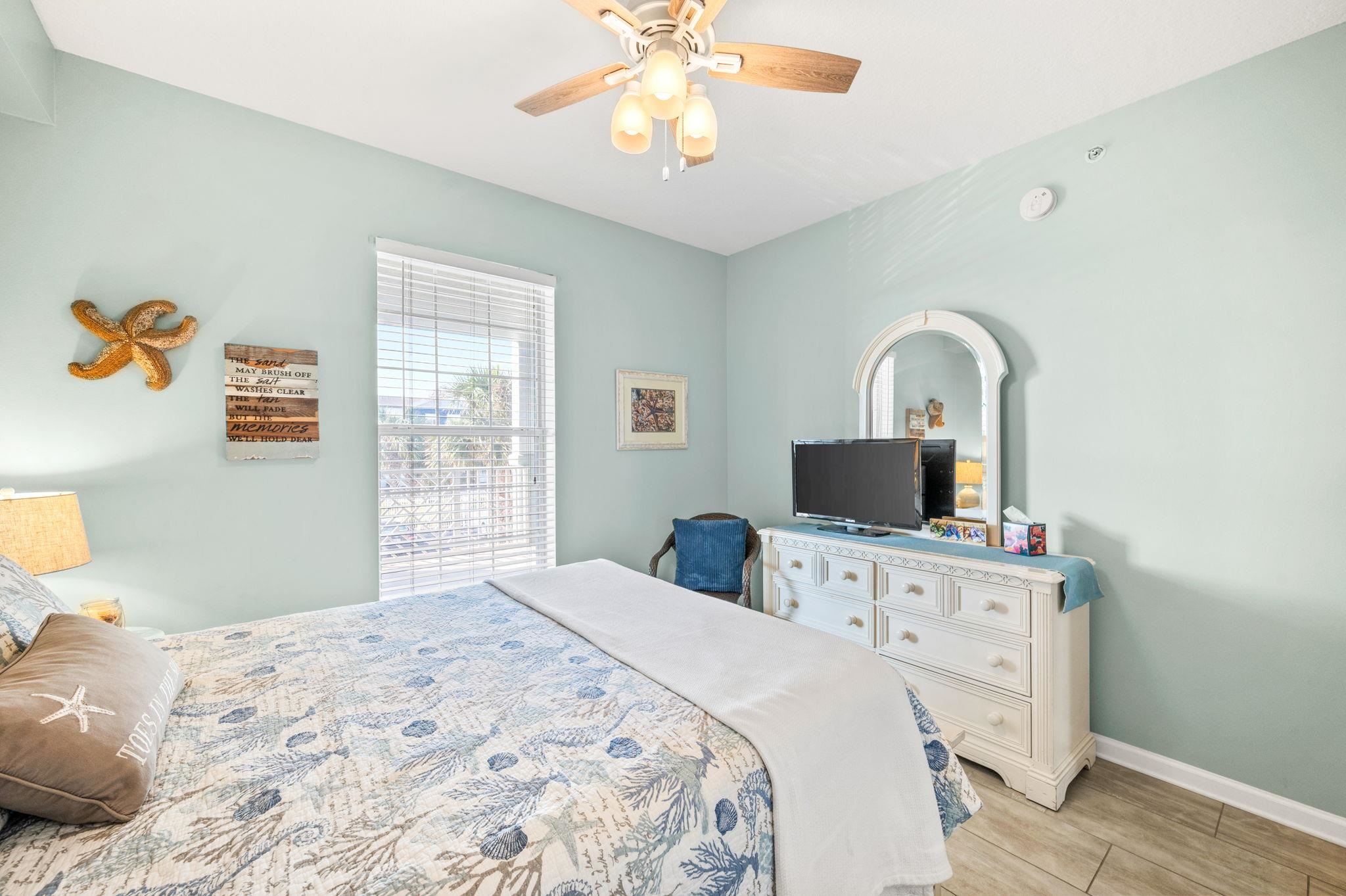 285 Atlantis Circle, Unit 203 St. Augustine, FL 32080 - Photo 40 of 71 a bedroom with a bed and a flat screen tv