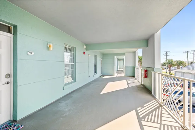 a view of a porch and wooden floor